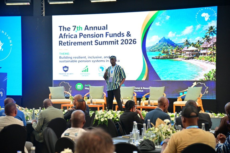Timothy Mukoba on stage at the 7th Annual Africa Pension Funds & Retirement Summit 2026 in Mauritius, in front of the summit screen showing its theme, with delegates at their tables.
