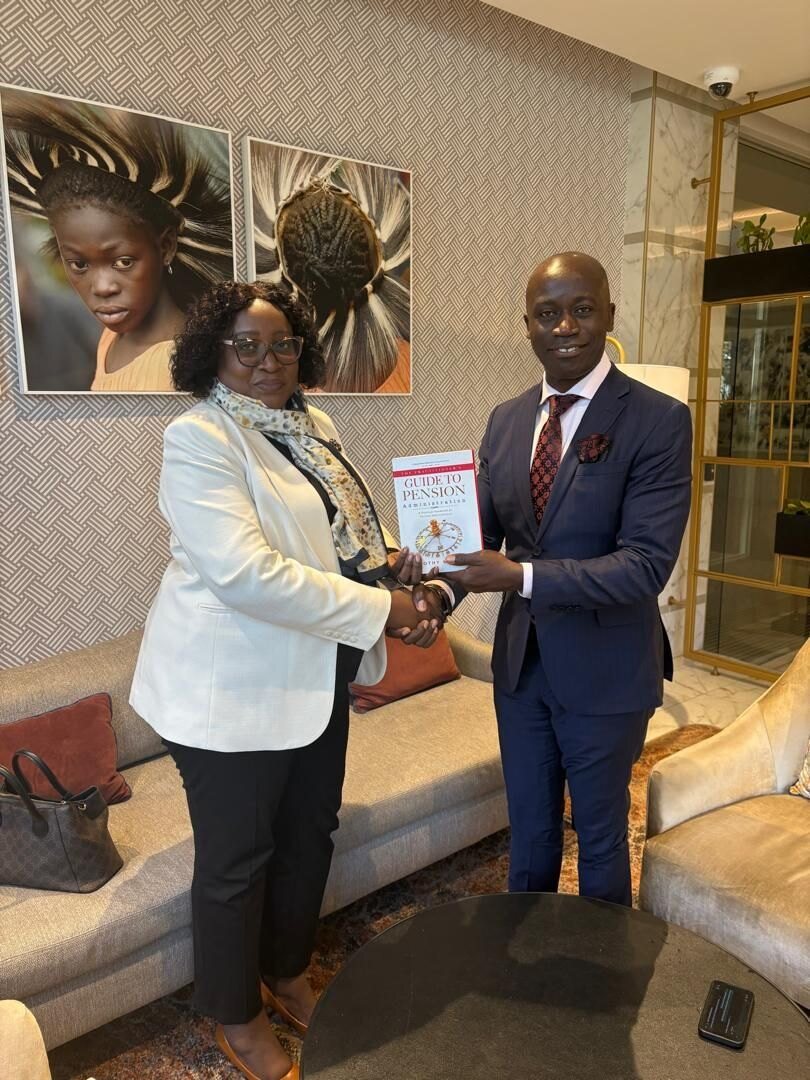 A copy of the book being presented in Lusaka.