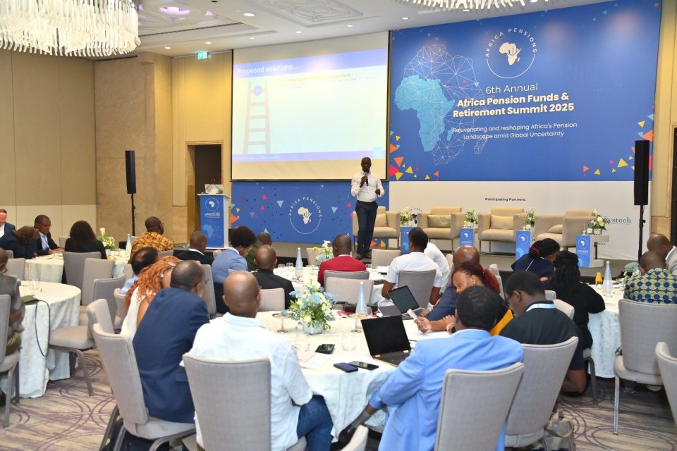 Timothy Mukoba presenting to delegates at the 6th Annual Africa Pension Funds & Retirement Summit 2025, with the summit banner behind the stage.